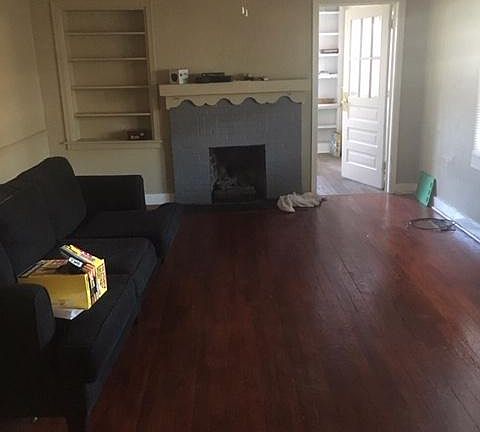 Living room with gas log fireplace.