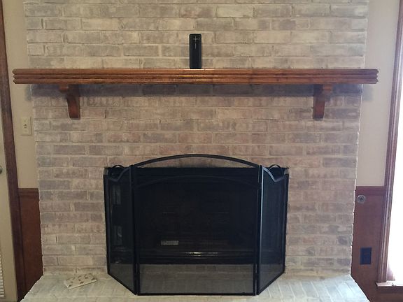 White-washed fireplace.