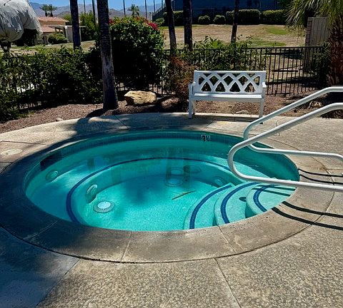 Spa in pool area.
