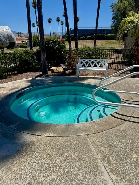 Spa in pool area.