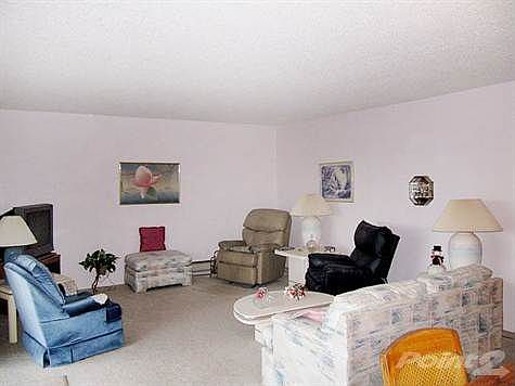 Spacious living room with view covered deck