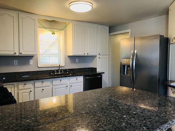 Kitchen with granite counters.