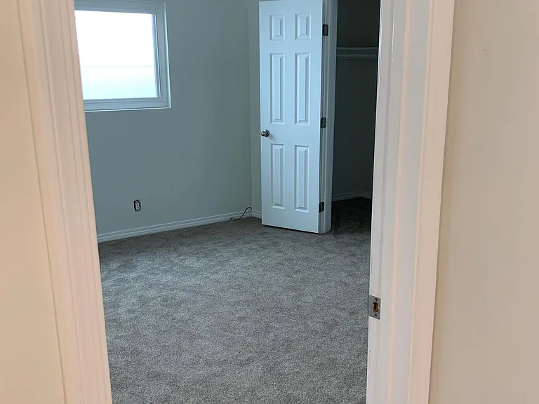 from hallway into bedroom #1 approx 12x12