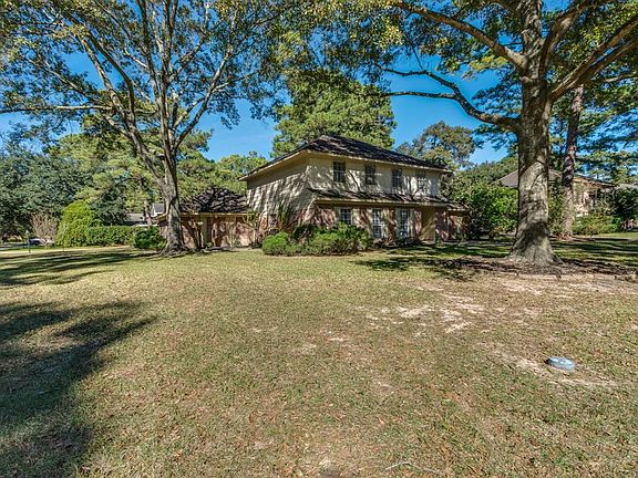 Great curb appeal, beautiful established shade trees frame this lovely home in Spring Creek Forest.