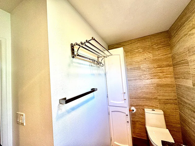 French towel racks used by Four Seasons hotel chain, one-piece stlat lined commode, and more built in cabinets
