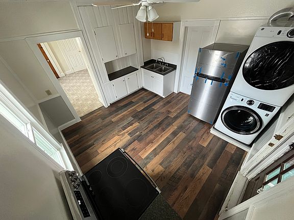 New Flooring and New Electric Stove, Refrigerator, and Stackable Laundry in this Eat In Kitchen.