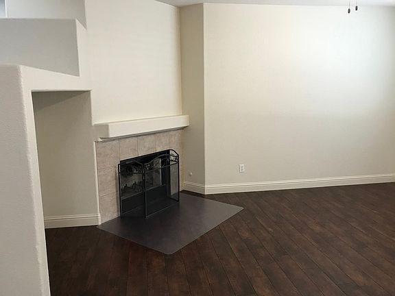 Family room showing fireplace (next to kitchen)