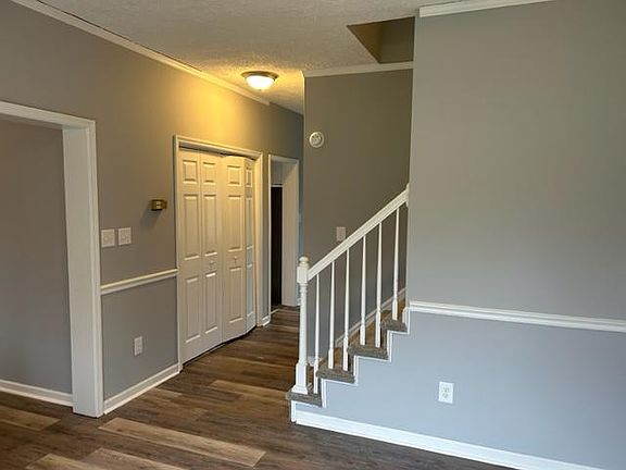 Living Room looking toward the Dining Room. The laundry room is on the left.