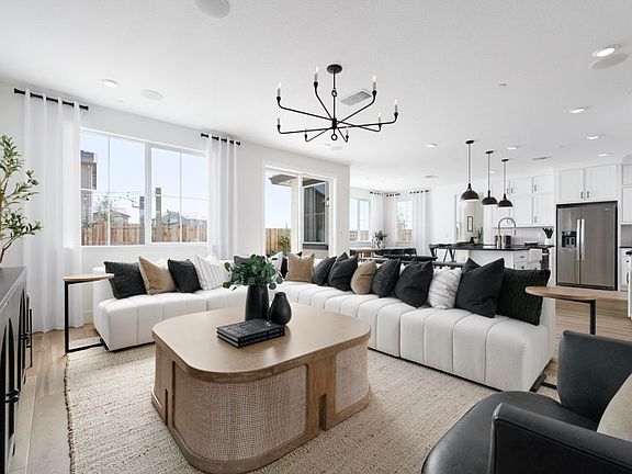 Gathering room leading into kitchen area