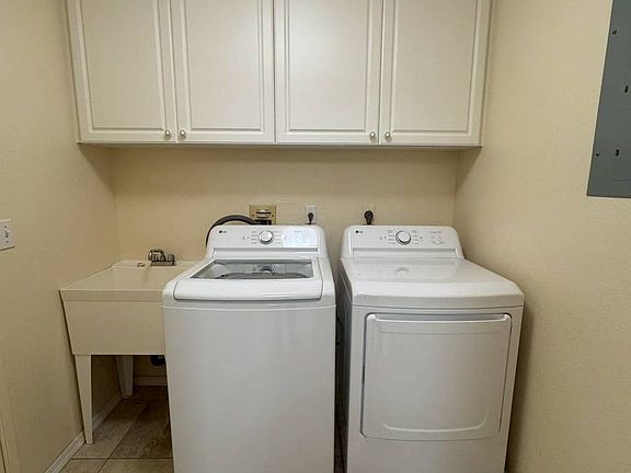 Washer/dryer room located right off the garage door entrance.