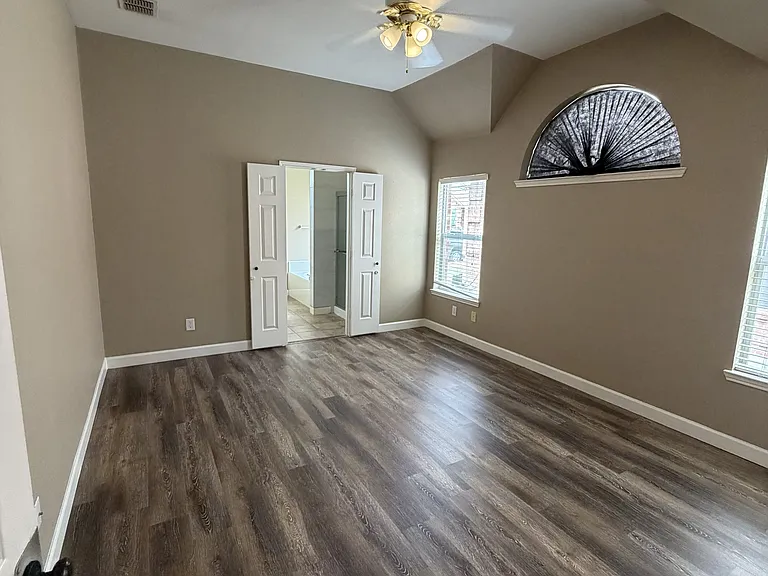 Primary bedroom with new floor.