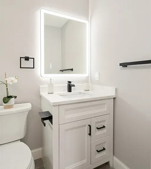 Prismatic and polished: Everything is brand new, from the modern vanity to the high-end fixtures_designed for a fresh start every morning.