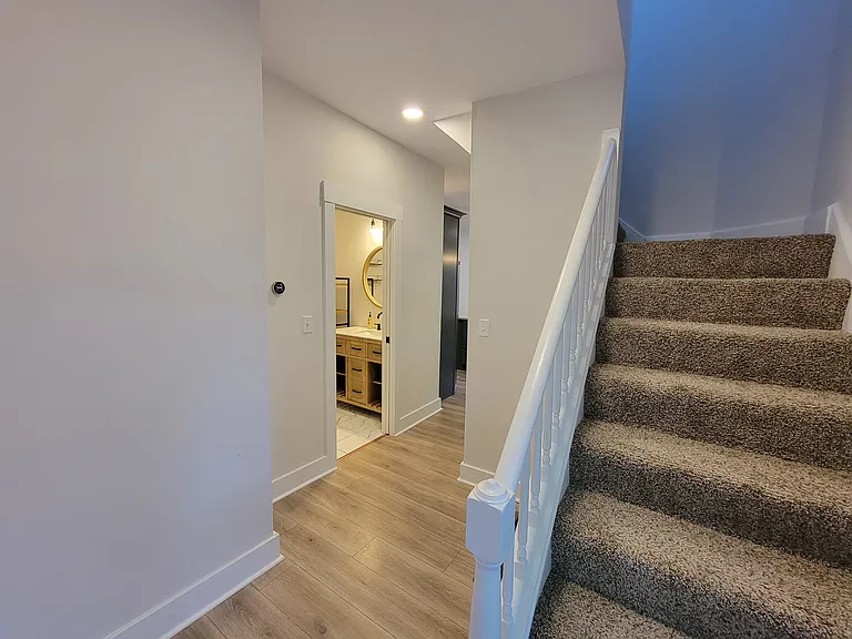 First Floor Bathroom and Stairs to Second Floor