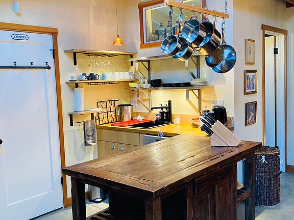 Laundry closet on left; kitchen sink & dishwasher
