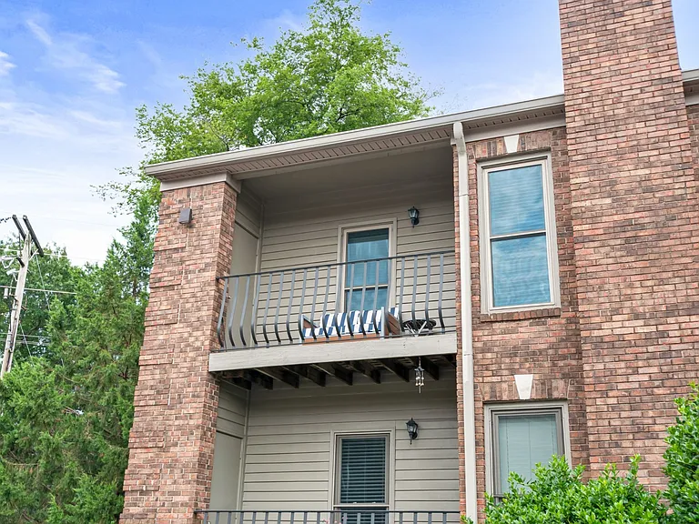 Relax or entertain year-round on the covered patio, offering a comfortable outdoor living space perfect for morning coffee or evening gatherings.