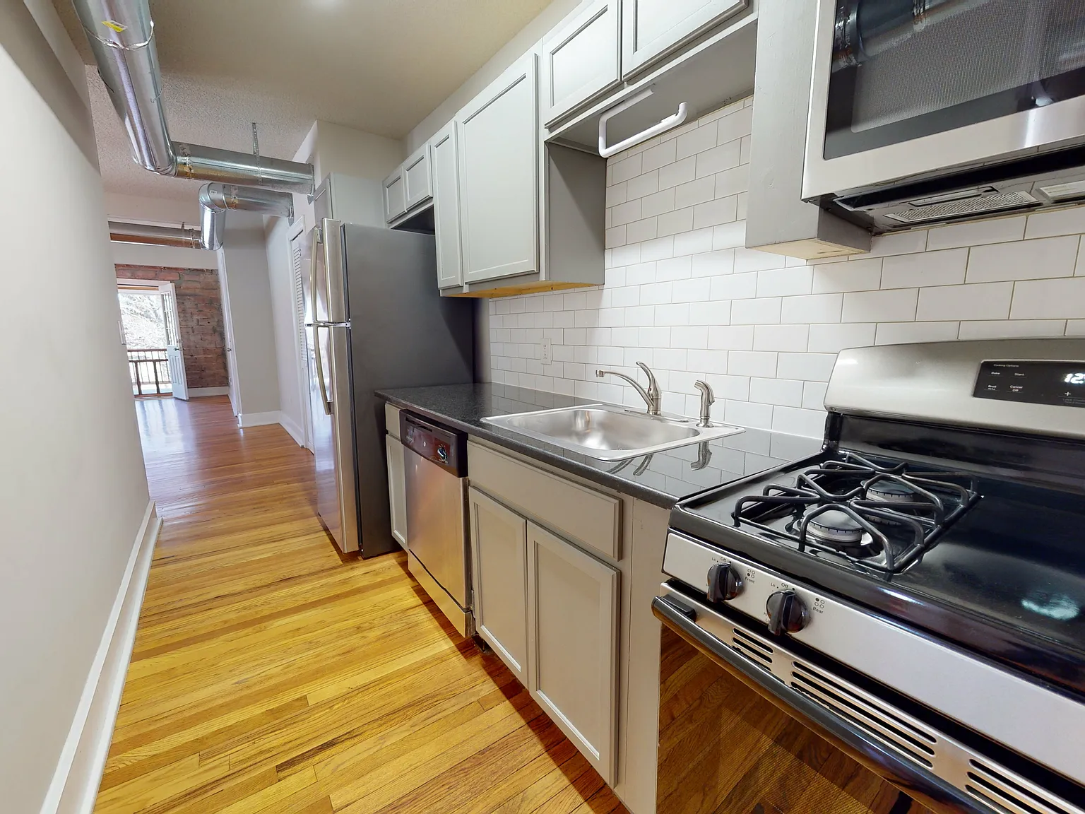 6020 Rockhill Rd | Updated Brookside Apartment — Photo 1
