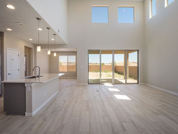 Walk into an open floorplan with lots of natural lighting