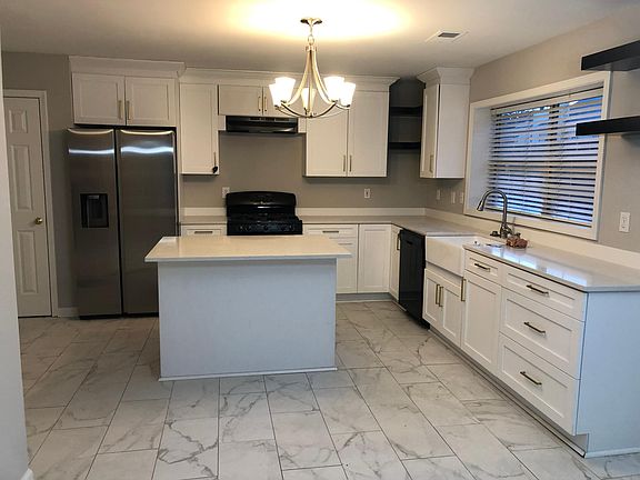 kitchen with brand new Samsung refrigerator
