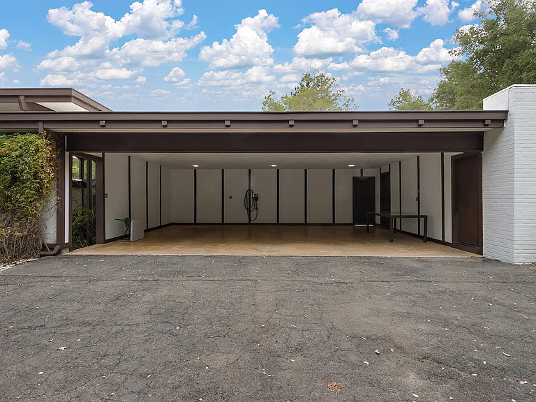 Carport accommodates 3 cars