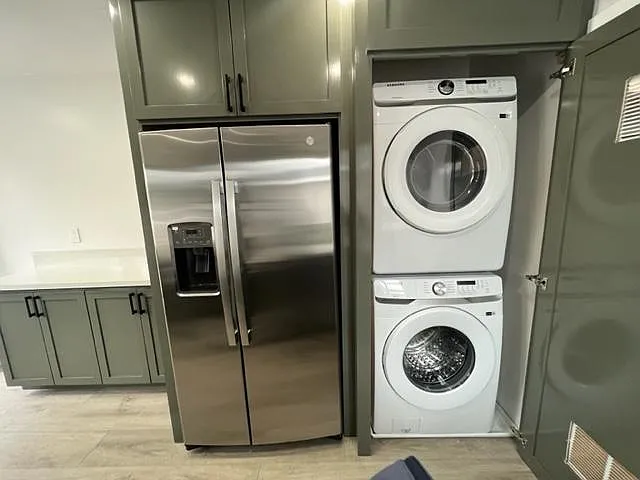 Full size washer and dryer in laundry canbinet