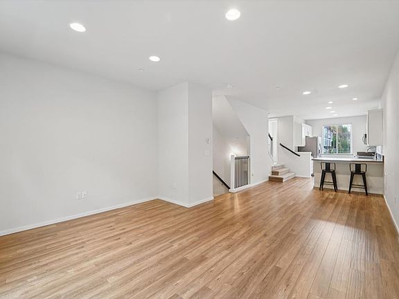 View of living & dining w/ kitchen