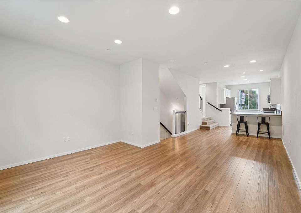 View of living & dining w/ kitchen