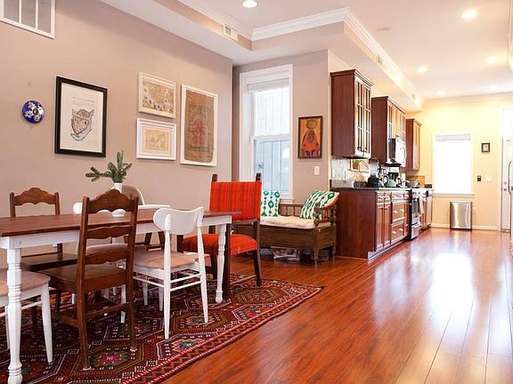 Dining area and large, open kitchen. Half bath is on the side.