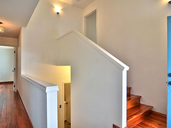 Entry - Stairs up lead to master bed/bath/deck. Stairs down lead to laundry room, huge storage closet under stairs, garage, and backyard. Hallway on left leads to bedroom #1, bath, and bedroom #2.