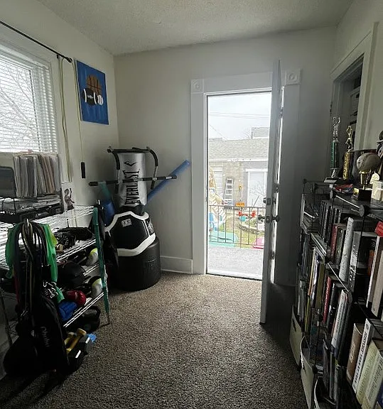Back bedroom with door to balcony