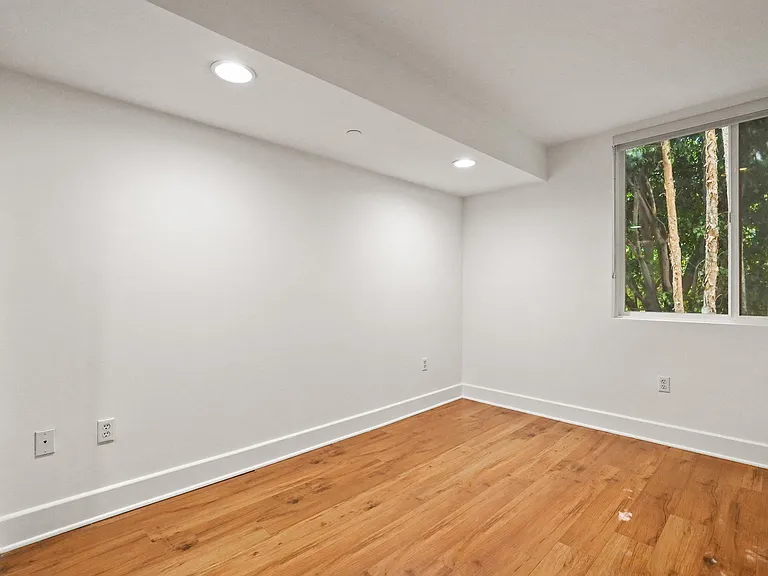 Bedroom with Recessed Lighting, Vinyl Flooring, and Windows