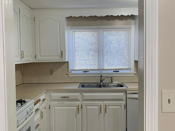 Kitchen with dishwasher & garbage disposal.