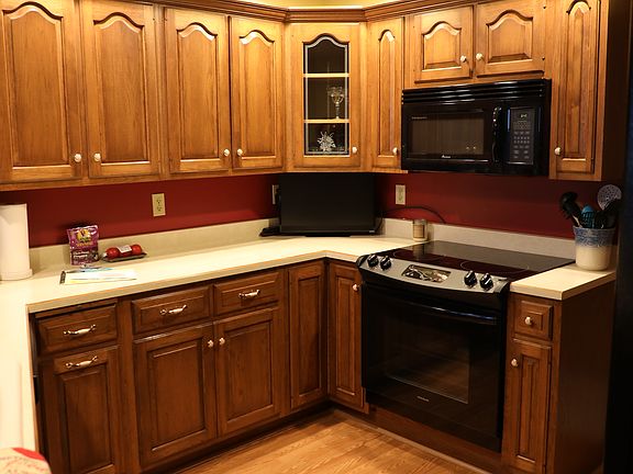Kitchen cabinets, appliances, and flooring