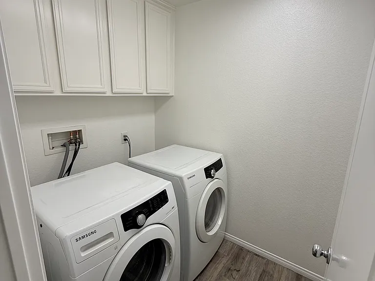 Upstairs Laundry room w/ washer and dryer
