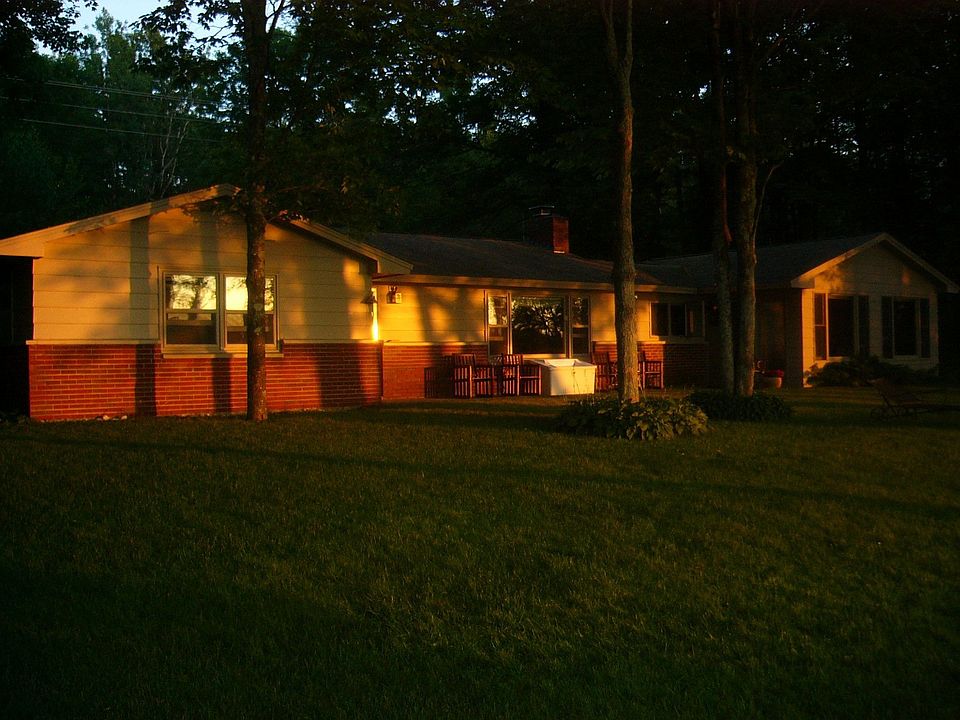 View of back of house at sunset