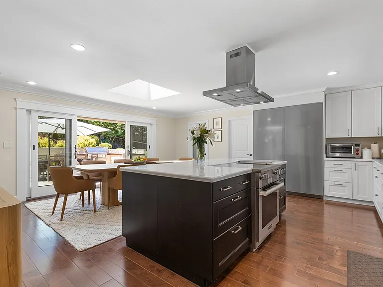 Chef's delight! Kitchen includes Miele double door refrigerator and Miele induction cooktop and oven