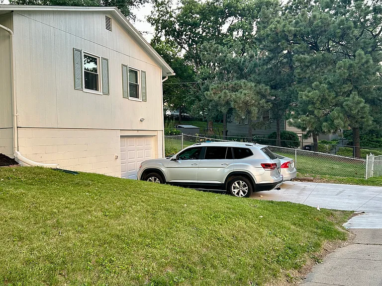 Single car garage and driveway for 2 cars.