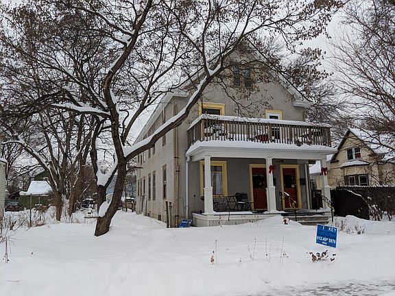 Front in winter, with south side yard, front door is on right.