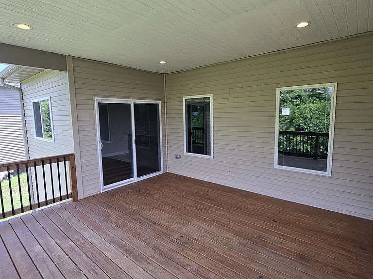 Deck facing Dining Room (door) and Living Room (windows)