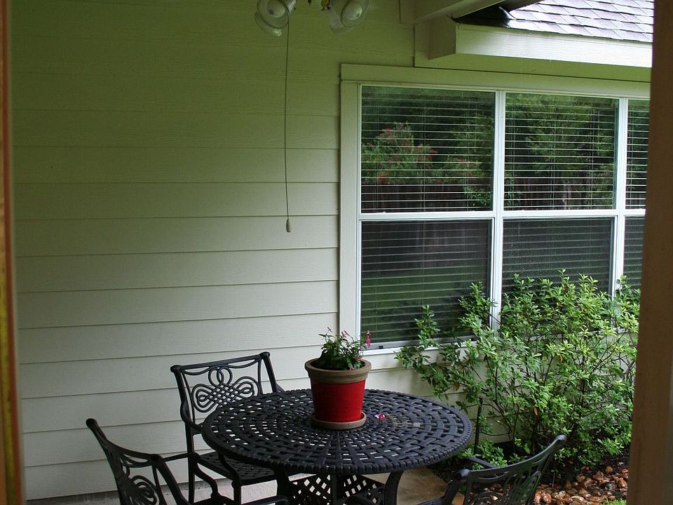Relax in this cozy covered patio after a long, busy day.