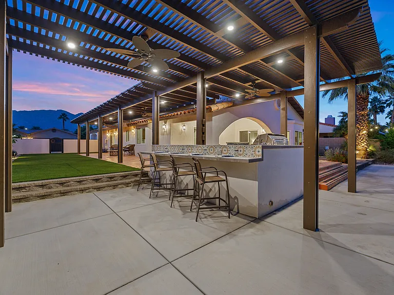 Plenty of counter space under the lighted pergola for you to cook and make homemade drinks!