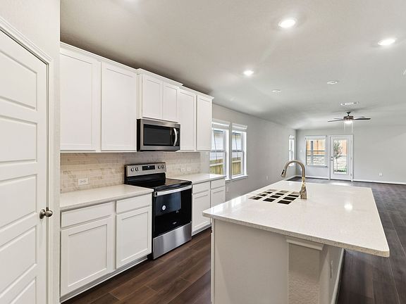 Kitchen in the Hughes floorplan at a Meritage Homes community.