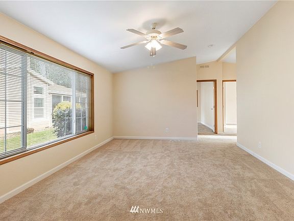 From the front door looking to the left, either a living room or dining room.