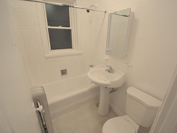 Bathroom with newer sink, toilet, and medicine cabinet!