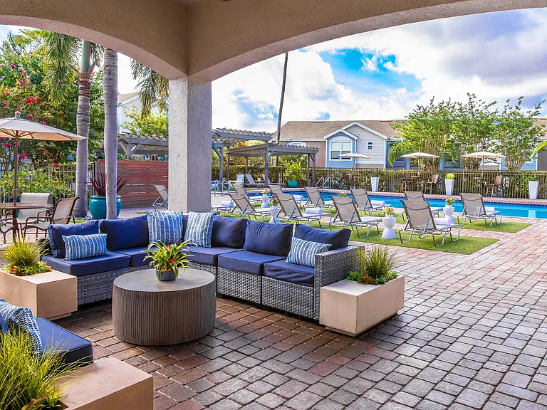 Unwind in style under our shaded outdoor loungeperfect for relaxing with friends or escaping the Florida sun.