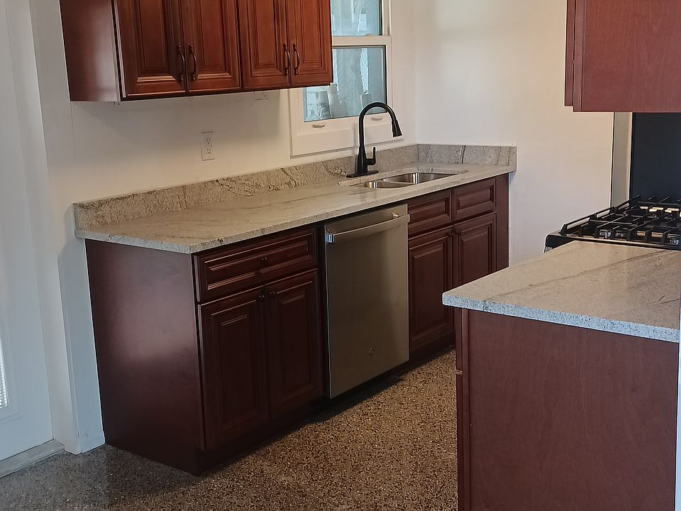 Kitchen with granite countertops and stainless steel appliances