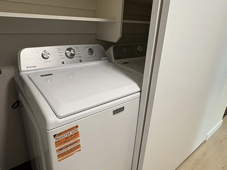Extra large capacity washing machine in unit.