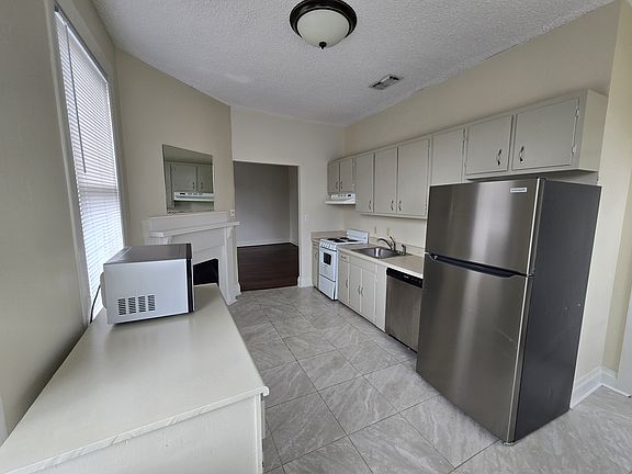 Fireplace at left corner of photo