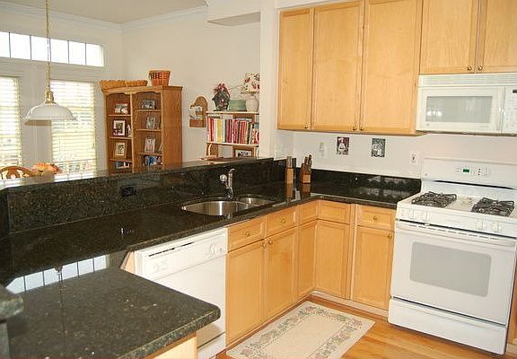 Kitchen features brand new granite counters