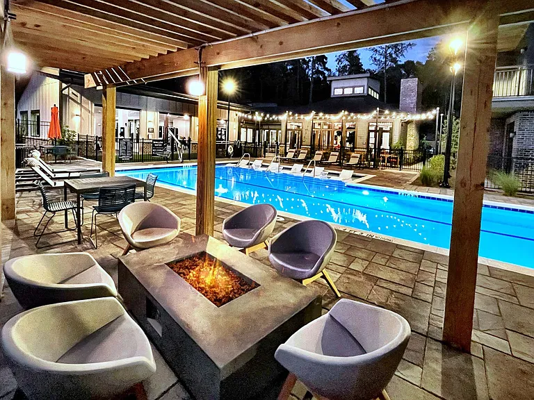 Relax under the stars with cozy firelight and poolside views