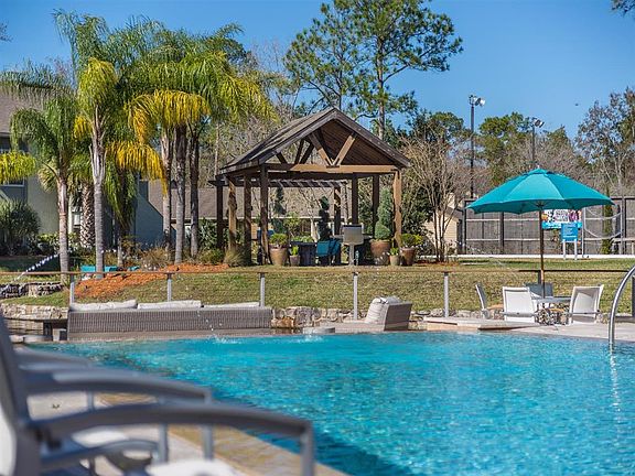 Poolside outdoor lounge with grills